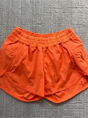 Lululemon 2.5” neon orange shorts